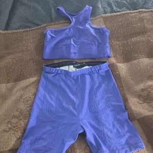 Cardi B and Reebok Calab Purple Sports Bra and Shorts Set